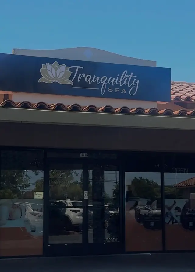 The Tranquility Spa sign, a lotus beside the script wordmark, over the glass front doors at 1815 Ygnacio Valley Rd